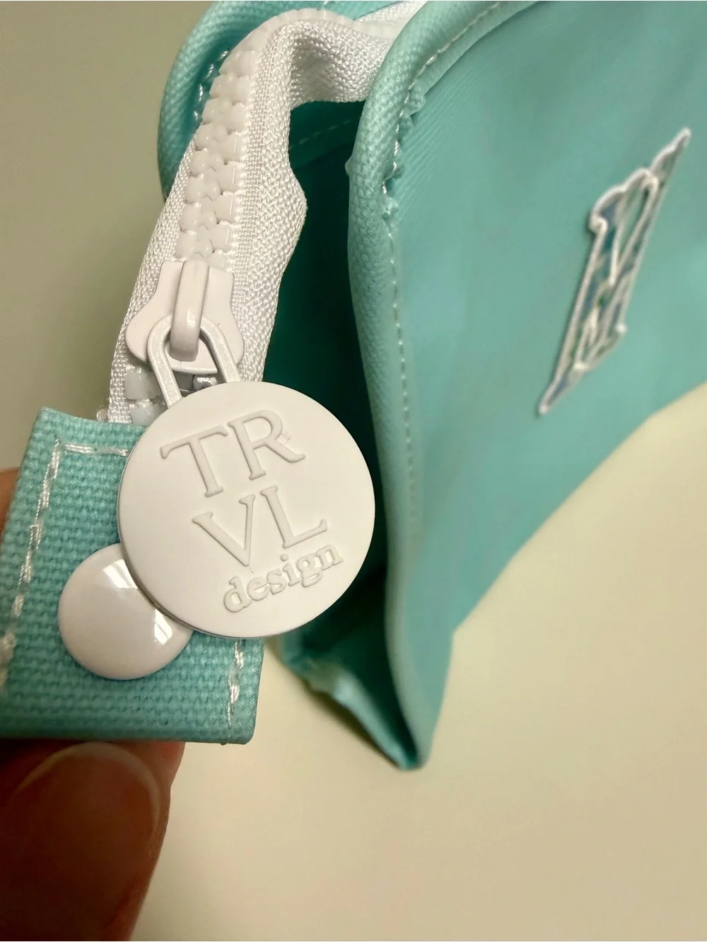 TRVL Design Turquoise Monogram Cosmetic Pouch with Decorative 'M'